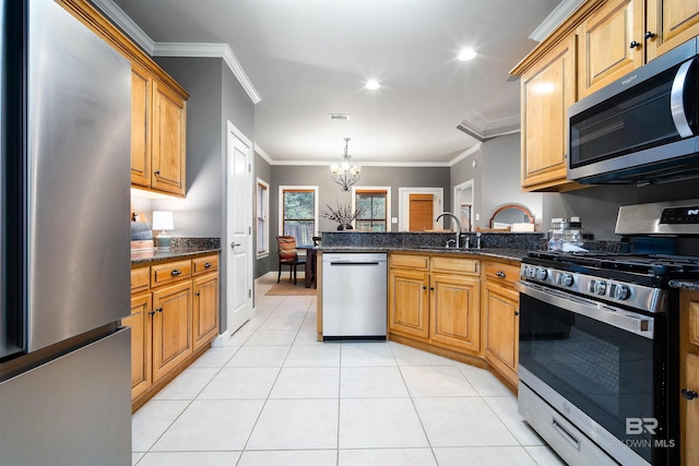 kitchen featuring light tile patterned flooring, a notable chandelier, stainless steel appliances, a peninsula, and ornamental molding