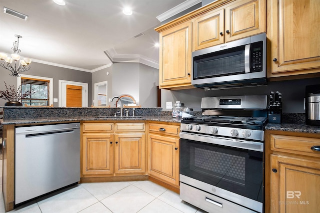 kitchen with stainless steel appliances, ornamental molding, light tile patterned flooring, and visible vents