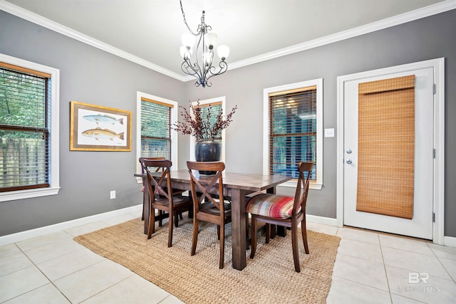 dining space featuring crown molding, a wealth of natural light, light tile patterned flooring, and a notable chandelier