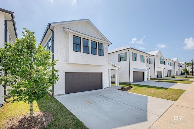 4645 Casablanca Dr, Orange Beach, AL 36561 - view of front of home featuring a garage, driveway, and a residential view