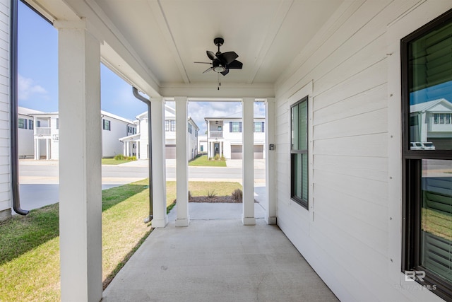 4645 Casablanca Dr, Orange Beach, AL 36561 - view of patio / terrace with a porch, a ceiling fan, and a residential view