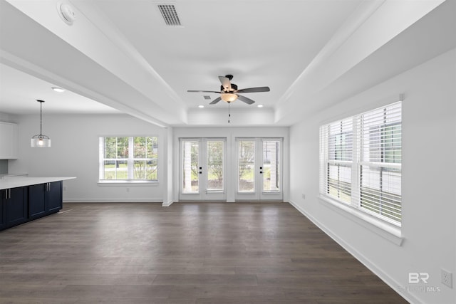 4645 Casablanca Dr, Orange Beach, AL 36561 - unfurnished living room with ceiling fan, a tray ceiling, baseboards, dark wood finished floors, and recessed lighting