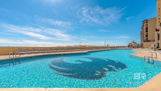 pool with a patio