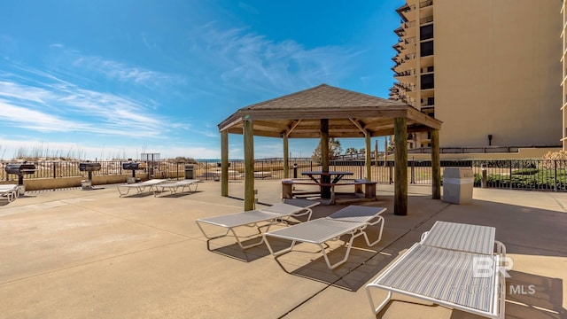 view of patio / terrace featuring fence