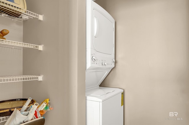 washroom featuring laundry area and stacked washer and clothes dryer