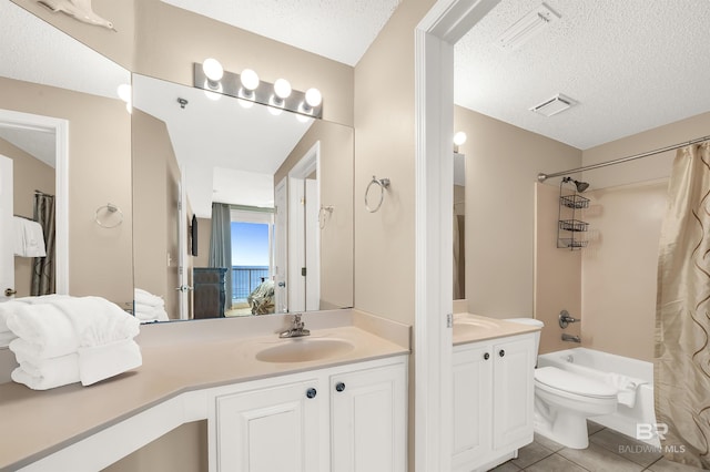 ensuite bathroom featuring tile patterned flooring, visible vents, ensuite bathroom, and a textured ceiling