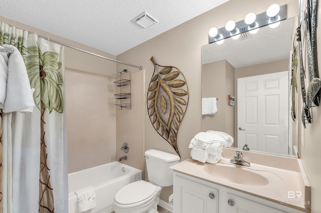 full bathroom featuring visible vents, toilet, shower / bath combo with shower curtain, a textured ceiling, and vanity