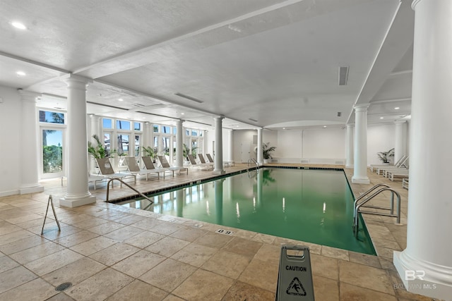 pool featuring decorative columns