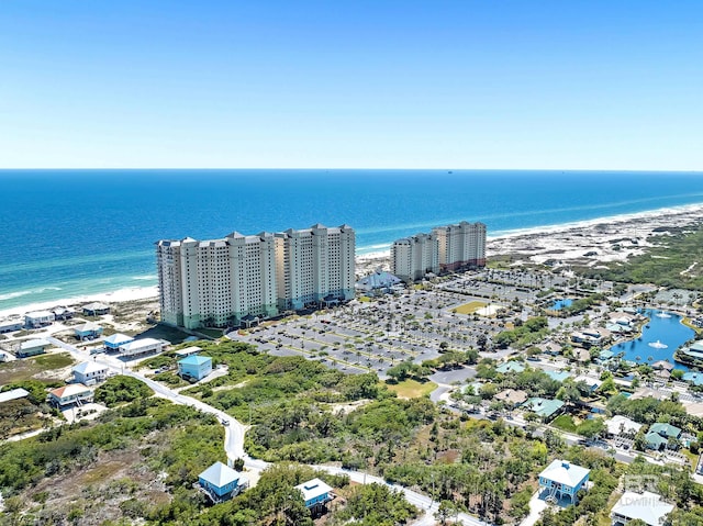 birds eye view of property featuring a city view and a water view