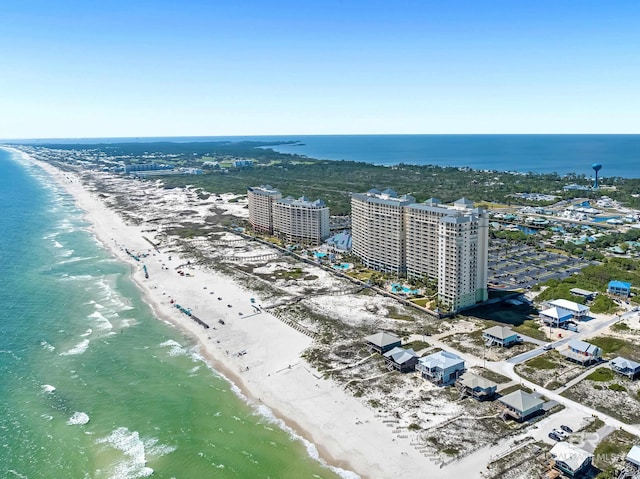 bird's eye view featuring a city view, a view of the beach, and a water view