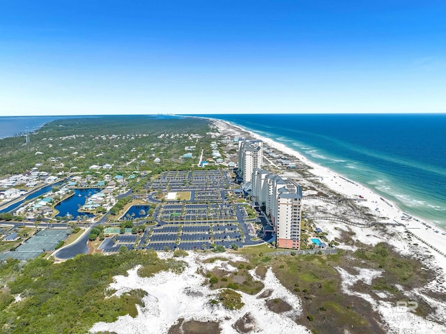 bird's eye view featuring a view of the beach and a water view