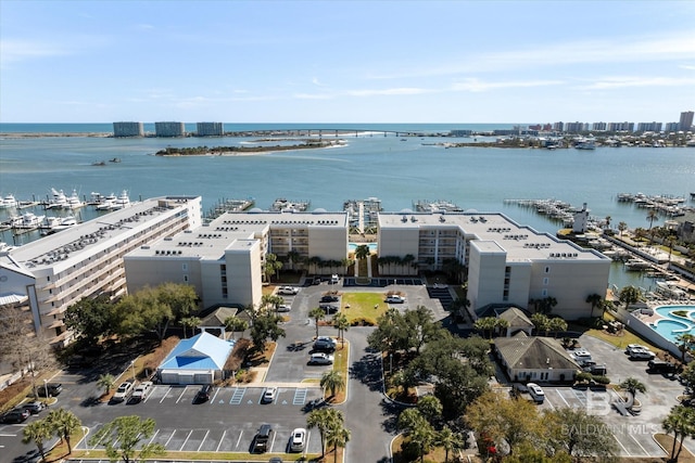 drone / aerial view featuring a water view and a city view