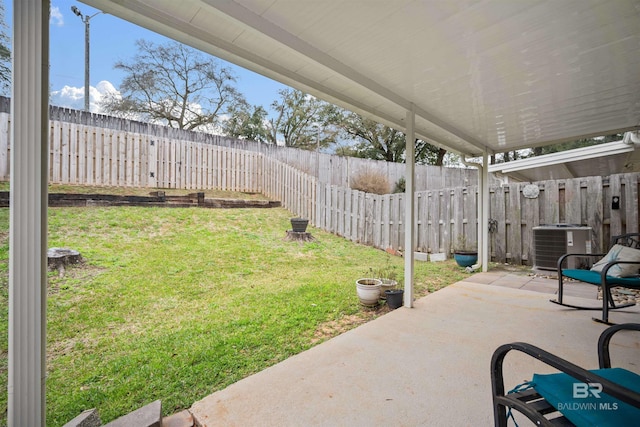 view of yard featuring central AC unit and a patio area