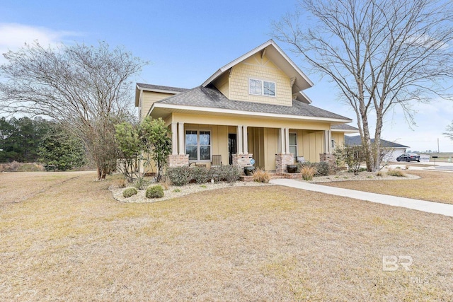 view of front of property featuring a porch and a front yard