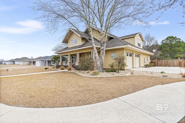 view of front of property featuring a garage and covered porch