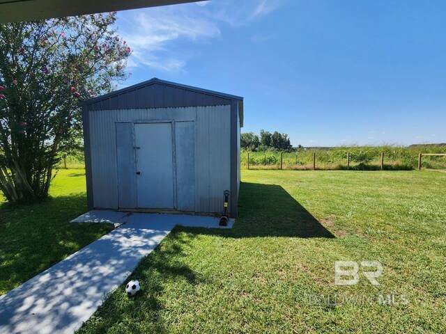 view of outbuilding with a lawn