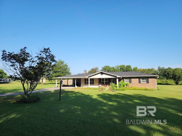 ranch-style home featuring a front yard