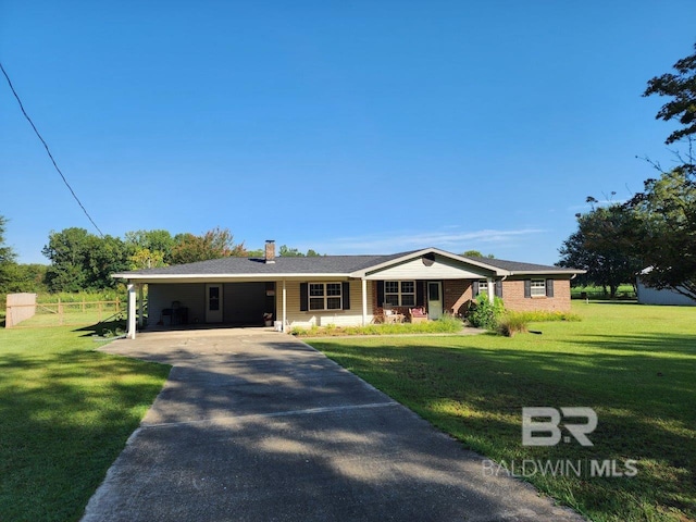 single story home featuring a front lawn and a carport