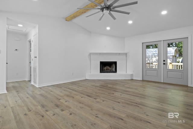 unfurnished living room featuring recessed lighting, a fireplace, light wood-style flooring, and lofted ceiling with beams