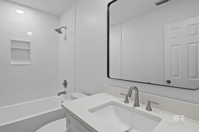 full bathroom featuring shower / washtub combination, visible vents, vanity, and toilet