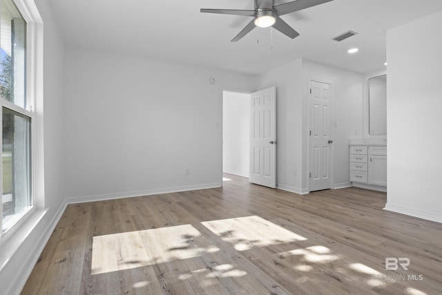 unfurnished bedroom featuring light wood-type flooring, visible vents, and baseboards