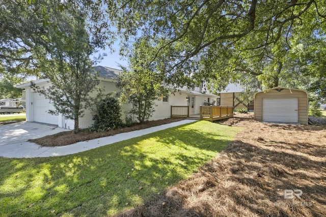 view of front of property featuring a garage, a front yard, and a wooden deck