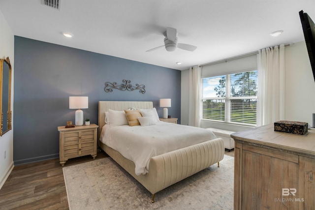 bedroom featuring dark hardwood / wood-style floors and ceiling fan