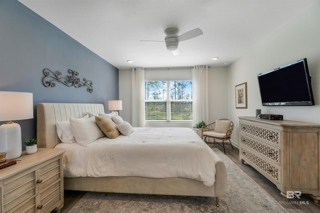 bedroom with ceiling fan and dark wood-type flooring