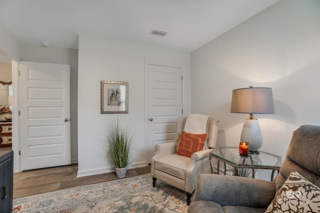 sitting room featuring hardwood / wood-style floors