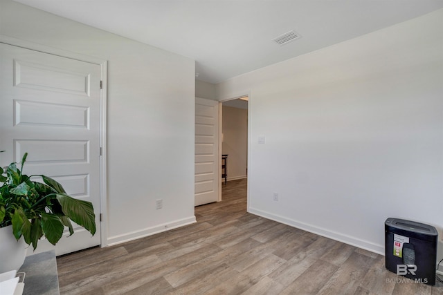 unfurnished room featuring light hardwood / wood-style floors