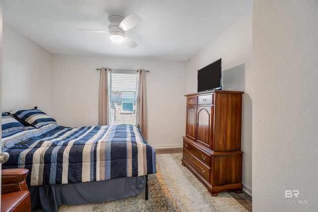 bedroom featuring ceiling fan and light hardwood / wood-style floors