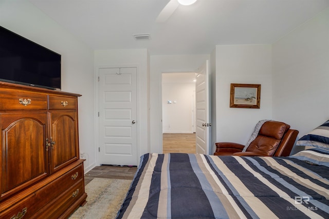 bedroom featuring ceiling fan and light hardwood / wood-style floors