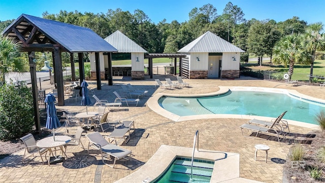 view of pool with a gazebo, a patio area, and an outdoor structure