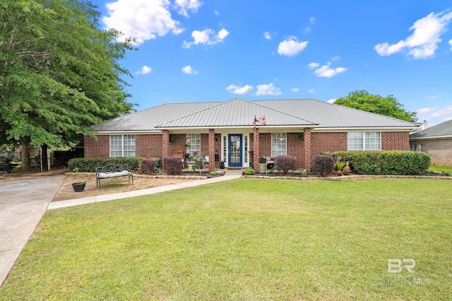 16596 Sugar Loop, Foley, AL 36535 - ranch-style house with brick siding, a front lawn, and metal roof
