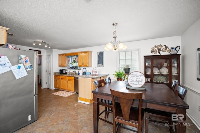 16596 Sugar Loop, Foley, AL 36535 - dining area with an inviting chandelier and a textured ceiling