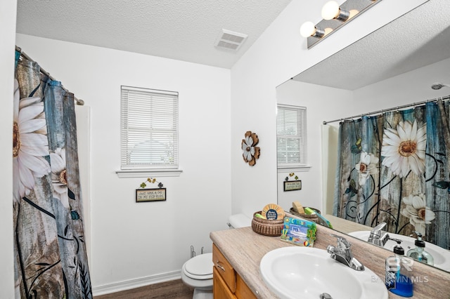 16596 Sugar Loop, Foley, AL 36535 - full bathroom with toilet, visible vents, a wealth of natural light, and wood finished floors