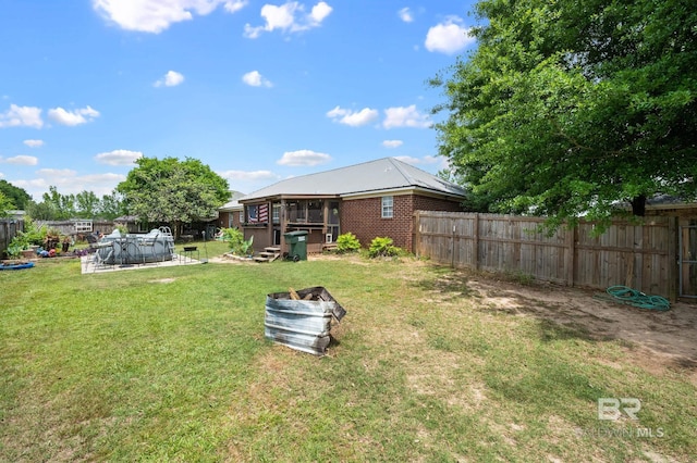 16596 Sugar Loop, Foley, AL 36535 - view of yard featuring fence, a swimming pool, and a sunroom