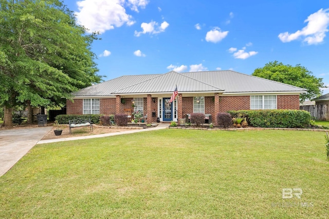 16596 Sugar Loop, Foley, AL 36535 - ranch-style house featuring brick siding, a front lawn, and metal roof