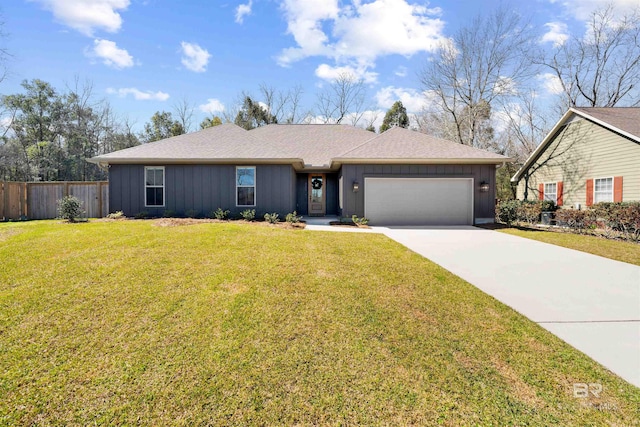 ranch-style house with a garage, fence, board and batten siding, and a front yard