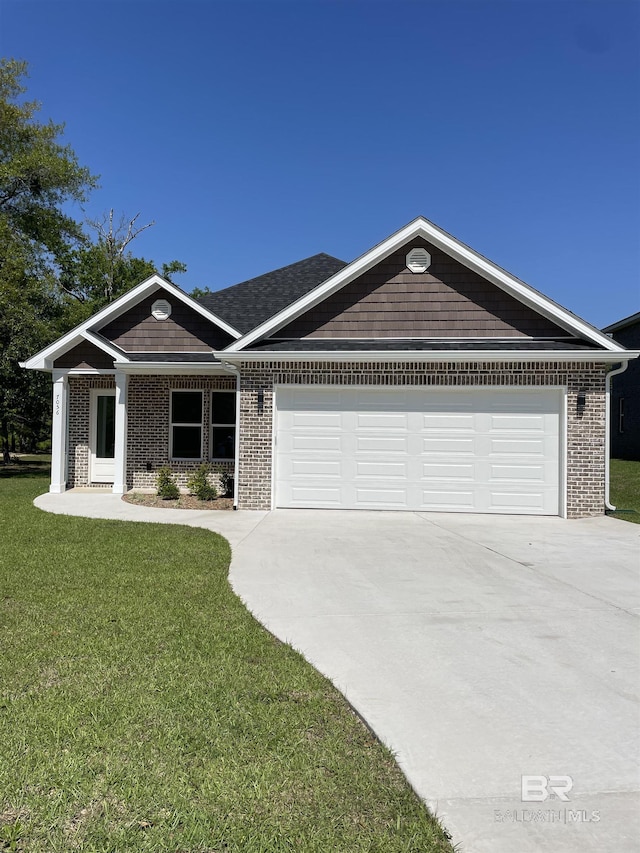 7056 Stone Chase Ln, Gulf Shores, AL 36542 - view of front of home with a garage, driveway, a front lawn, and brick siding