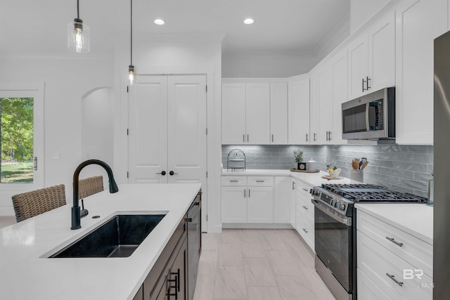 7056 Stone Chase Ln, Gulf Shores, AL 36542 - kitchen featuring light countertops, marble finish floor, stainless steel appliances, and a sink