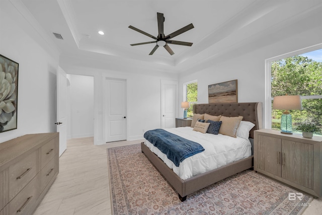 7056 Stone Chase Ln, Gulf Shores, AL 36542 - bedroom with recessed lighting, a raised ceiling, visible vents, and multiple windows