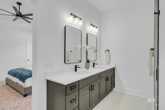 7056 Stone Chase Ln, Gulf Shores, AL 36542 - ensuite bathroom with baseboards, a sink, and ceiling fan