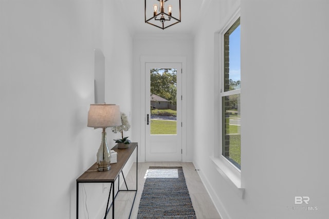 7056 Stone Chase Ln, Gulf Shores, AL 36542 - doorway with baseboards and a chandelier