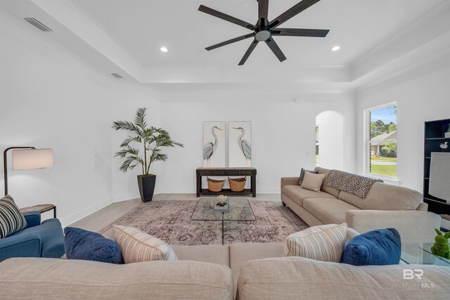 7056 Stone Chase Ln, Gulf Shores, AL 36542 - living area featuring recessed lighting, a tray ceiling, visible vents, arched walkways, and ceiling fan
