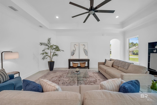 7056 Stone Chase Ln, Gulf Shores, AL 36542 - living area featuring recessed lighting, a tray ceiling, visible vents, arched walkways, and ceiling fan