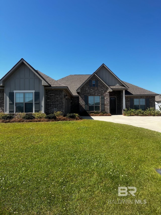 10606 Secretariat Blvd, Daphne, AL 36526 - craftsman inspired home featuring brick siding, board and batten siding, and a front yard