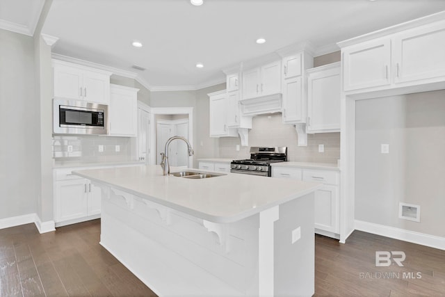 10606 Secretariat Blvd, Daphne, AL 36526 - kitchen with dark wood-style floors, a sink, stainless steel appliances, and baseboards