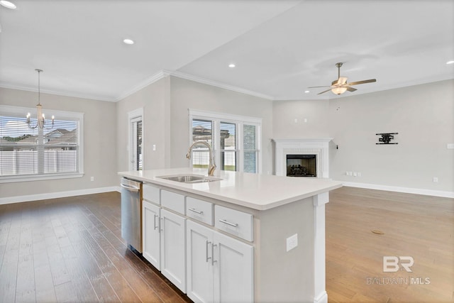 10606 Secretariat Blvd, Daphne, AL 36526 - kitchen featuring stainless steel dishwasher, dark wood-style floors, a sink, and ceiling fan with notable chandelier