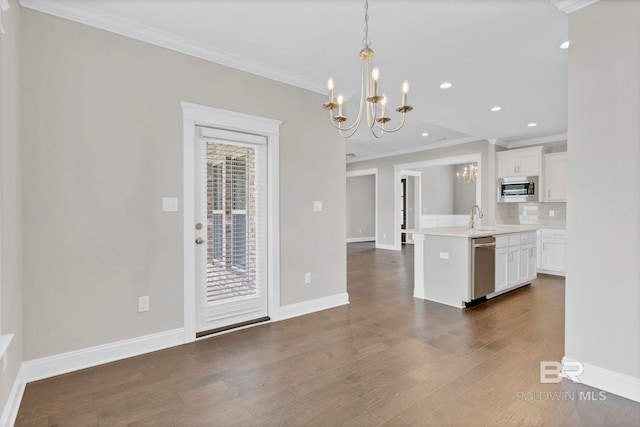 10606 Secretariat Blvd, Daphne, AL 36526 - kitchen featuring a sink, a chandelier, stainless steel appliances, light countertops, and ornamental molding